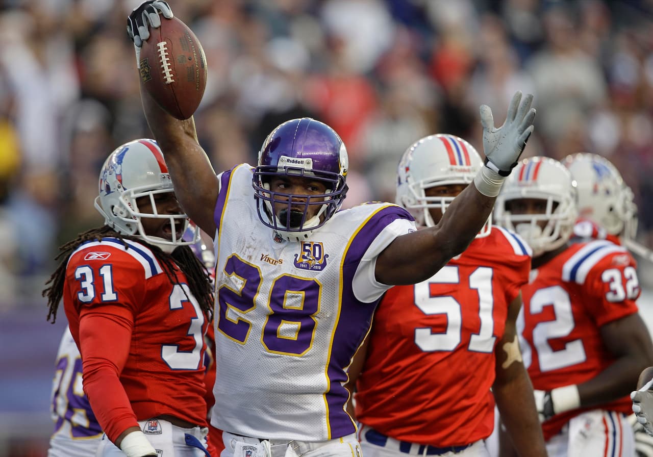 Minnesota Vikings running back Adrian Peterson (28) celebrates after scoring a touchdown early in the second quarter during an NFL football game against the New England Patriots in Foxborough, Mass., Sunday, Oct. 31, 2010. (AP/Photo/Stephan Savoia)