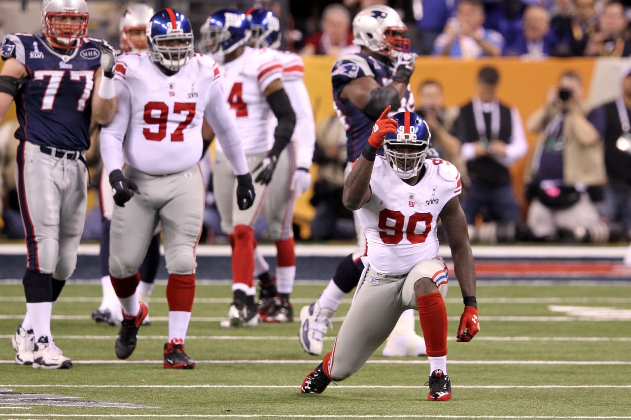 INDIANAPOLIS, IN - FEBRUARY 05: Jason Pierre-Paul #90 of the New York Giants reacts agaist the New England Patriots during Super Bowl XLVI at Lucas Oil Stadium on February 5, 2012 in Indianapolis, Indiana. The Giants won 21-17. (Photo by Andy Lyons/Getty Images)