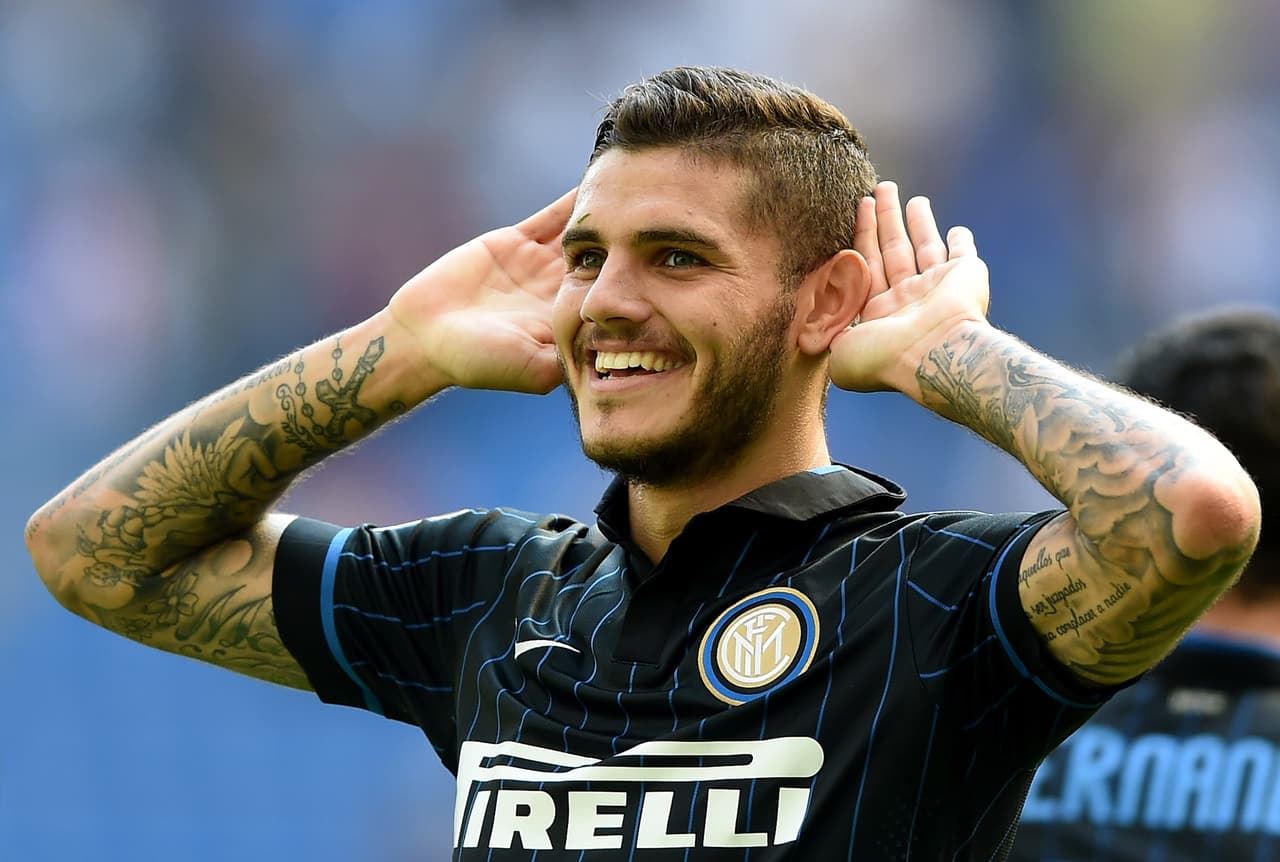 MILAN, ITALY - SEPTEMBER 14: Mauro Icardi of FC Internazionale Milano celebrates his second goal during the Serie A match between FC Internazionale Milano and US Sassuolo Calcio at Stadio Giuseppe Meazza on September 14, 2014 in Milan, Italy. (Photo by Claudio Villa - Inter/Inter via Getty Images)