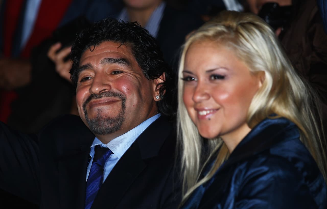 LONDON, ENGLAND - NOVEMBER 22: Former Argentinian footballer Diego Maradona smiles with Veronica Ojeda in the match between Novak Djokovic of Serbia and Tomas Berdych of Czech Republic during the Barclays ATP World Tour Finals at the O2 Arena on November 22, 2010 in London, England. (Photo by Julian Finney/Getty Images)
