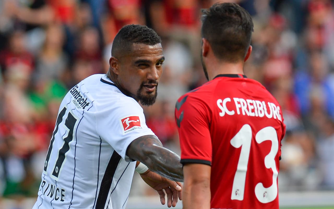 Frankfurt's Ghanaian midfielder Kevin-Prince Boateng (L) shakes hand with Freiburg's midfielder Marco Terrazzino after the German first division Bundesliga football match SC Freiburg vs Eintracht Frankfurt in Freiburg, southwestern Germany, on August 20, 2017. / AFP PHOTO / THOMAS KIENZLE (Photo credit should read THOMAS KIENZLE/AFP/Getty Images)