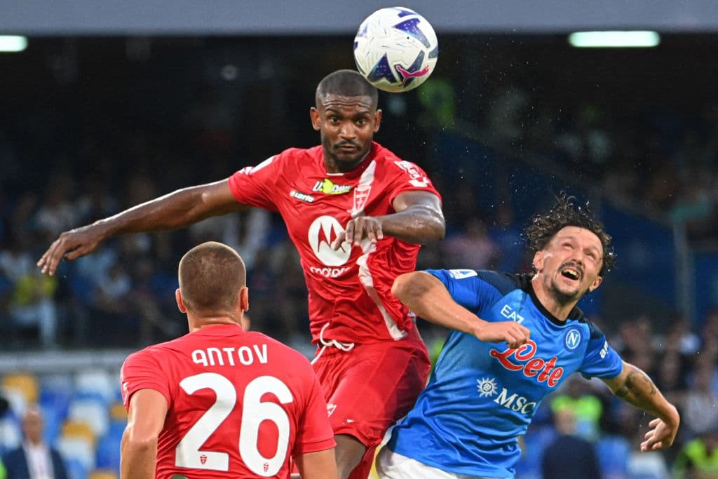 Napoli's Portuguese defender Mario Rui (R) and Monza's Brazilian defender Marlon go for a header during the Italian Serie A football match between Napoli and Monza on August 21, 2022 at the Diego-Maradona stadium in Naples. (Photo by Alberto PIZZOLI / AFP) (Photo by ALBERTO PIZZOLI/AFP via Getty Images)