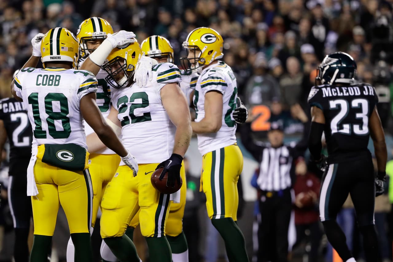 Green Bay Packers' Aaron Ripkowski (22) celebrates with teammates after scoring a touchdown during the second half of an NFL football game against the Philadelphia Eagles, Monday, Nov. 28, 2016, in Philadelphia. (AP Photo/Matt Rourke)