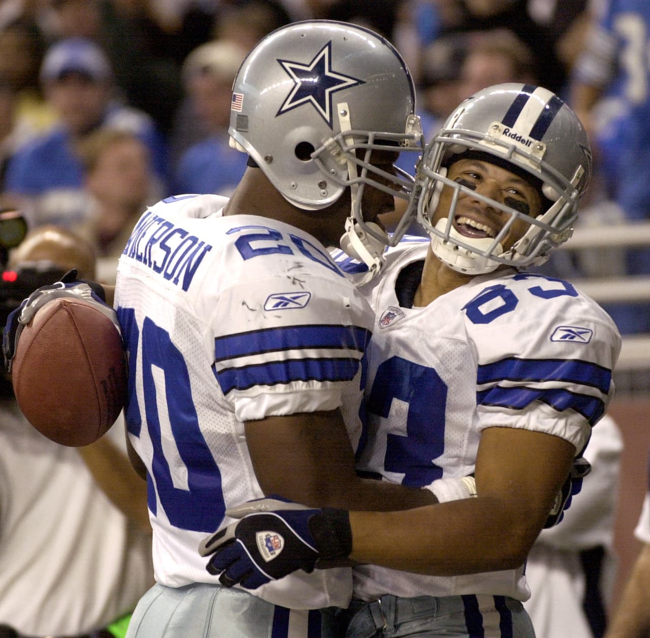 Dallas Cowboys wide receiver Terry Glenn, right, celebrates with fullback Richie Anderson (20) after Glenn caught a pass for a touchdown in the second quarter against the Detroit Lions in Detroit, Sunday, Oct. 19, 2003. (AP Photo/Paul Sancya)