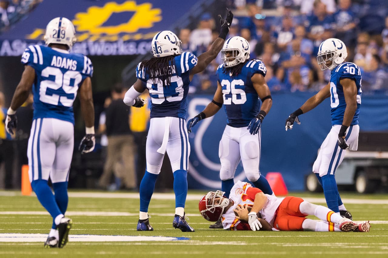 Indianapolis Colts outside linebacker Erik Walden (93) waves for training staff for Kansas City Chiefs quarterback Alex Smith (11) after he was hit during the NFL regular season football game on Sunday, Oct. 30, 2016 in Indianapolis. The Chiefs won, 30-14. Smith suffered a concussion during the game. (Ric Tapia via AP)
