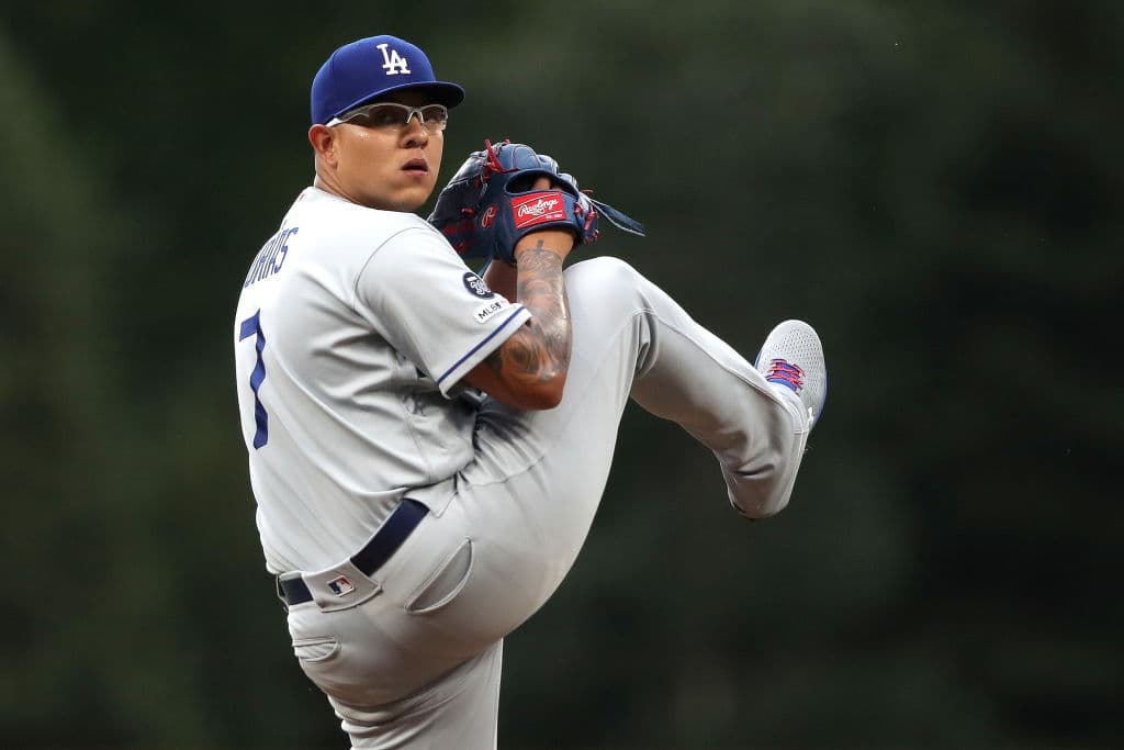 DENVER, COLORADO - JULY 30: Starting pitcher Julio Urias #7 of the Los Angeles Dodgers throws in the first inning against the Colorado Rockies at Coors Field on July 30, 2019 in Denver, Colorado. (Photo by Matthew Stockman/Getty Images)