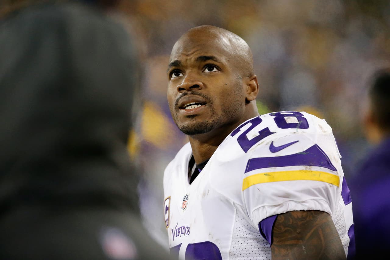 GREEN BAY, WI - JANUARY 03: Adrian Peterson #28 of the Minnesota Vikings looks on during the second half against the Green Bay Packers at Lambeau Field on January 3, 2016 in Green Bay, Wisconsin. (Photo by Jon Durr/Getty Images)