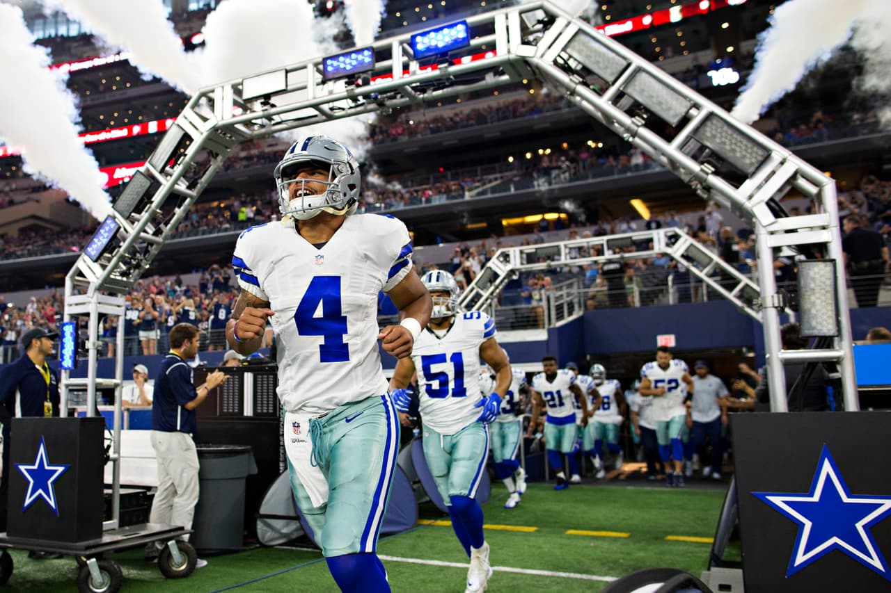 ARLINGTON, TX - SEPTEMBER 1: Dak Prescott #4 of the Dallas Cowboys runs onto the field before a preseason game against the Houston Texans at AT&T Stadium on September 1, 2016 in Arlington, Texas. The Texans defeated the Cowboys 28-17. (Photo by Wesley Hitt/Getty Images)