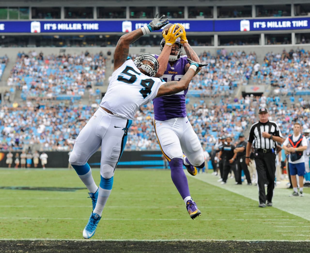 Minnesota Vikings' Kyle Rudolph (82) catches a touchdown pass over Carolina Panthers' Shaq Green-Thompson (54) in the second half of an NFL football game in Charlotte, N.C., Sunday, Sept. 25, 2016. (AP Photo/Mike McCarn)