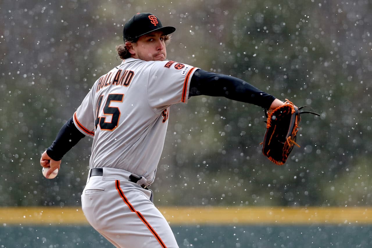 Derek Holland acusó a los Giants de hacerle fingir una lesión