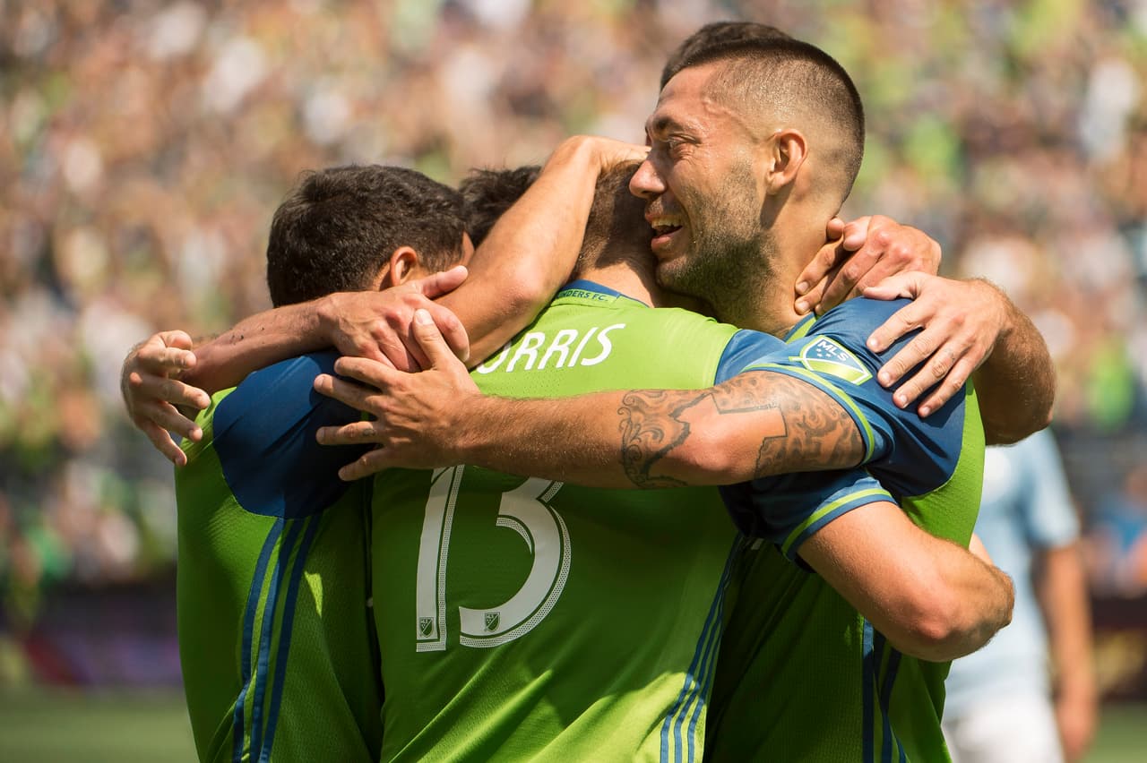 Aug 12, 2017; Seattle, WA, USA; Seattle Sounders midfielder Clint Dempsey (2) celebrates with teammates after scoring a goal in the first half against Sporting Kansas City at CenturyLink Field. The Sounders won 1-0. Mandatory Credit: Troy Wayrynen-USA TODAY Sports