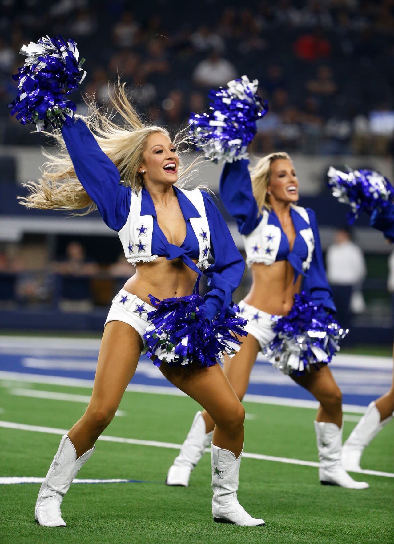Dallas Cowboys cheerleaders perform during the second half of a preseason NFL football game between the Dallas Cowboys and the Arizona Cardinals in Arlington, Texas, Sunday, Aug. 26, 2018. (AP Photo/Michael Ainsworth)