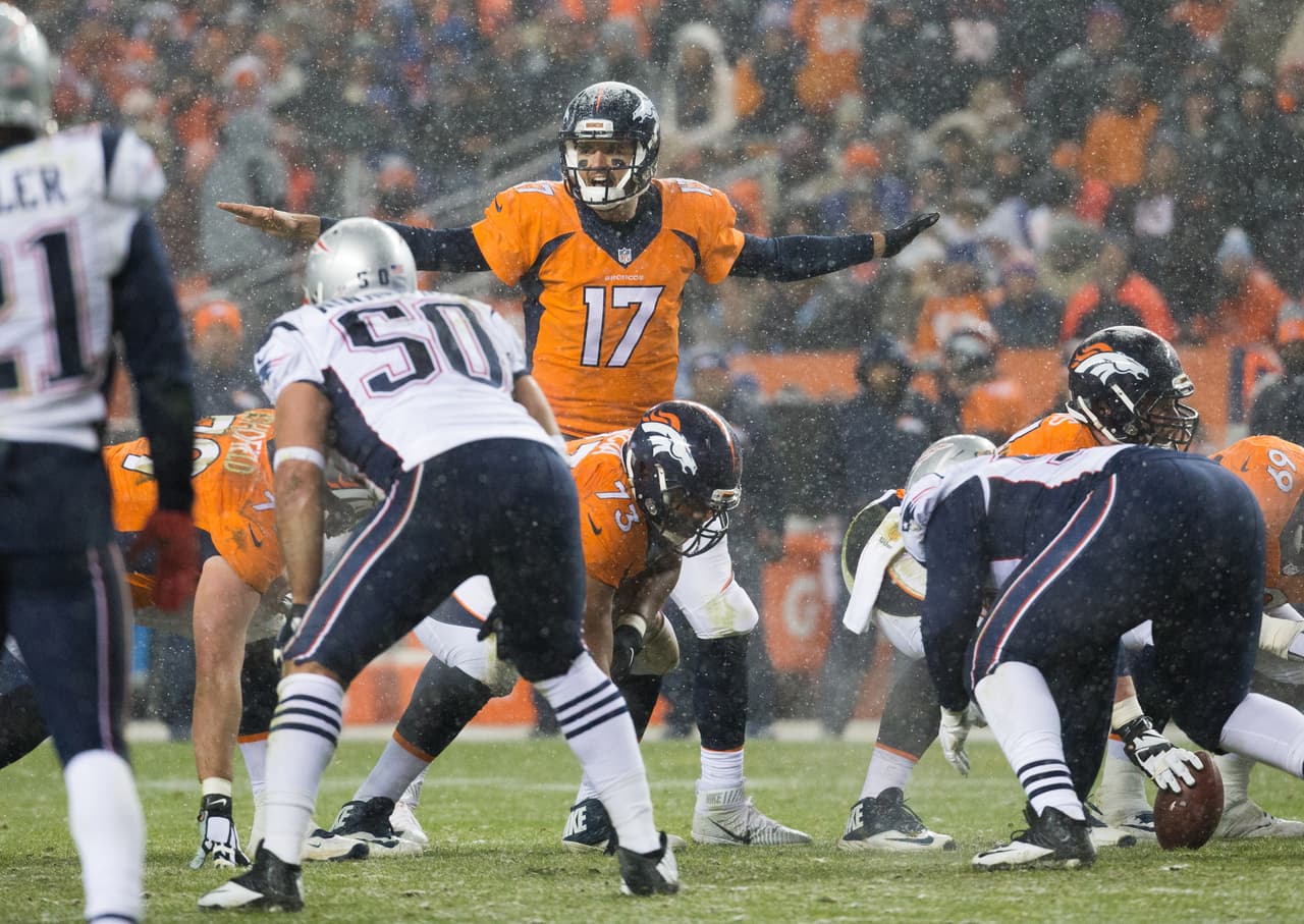 Denver Broncos quarterback Brock Osweiler (17) calls a play at the line of scrimmage during an NFL football game against the New England Patriots on Sunday, Nov. 29, 2015 in Denver. (Peter Read Miller via AP)