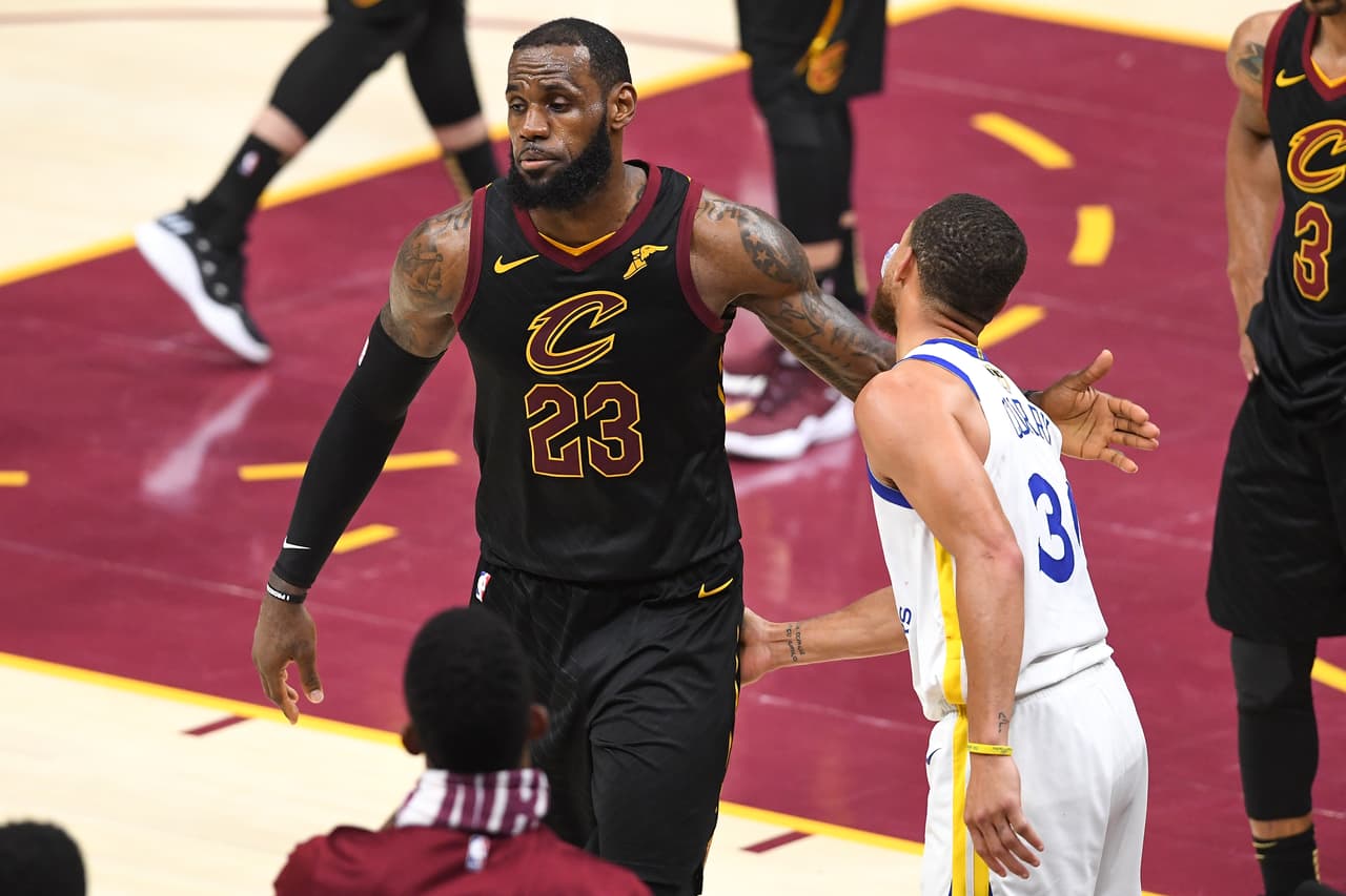 CLEVELAND, OH - JUNE 08: LeBron James #23 of the Cleveland Cavaliers shakes hands with Stephen Curry #30 of the Golden State Warriors during Game Four of the 2018 NBA Finals at Quicken Loans Arena on June 8, 2018 in Cleveland, Ohio. NOTE TO USER: User expressly acknowledges and agrees that, by downloading and or using this photograph, User is consenting to the terms and conditions of the Getty Images License Agreement. (Photo by Jason Miller/Getty Images)