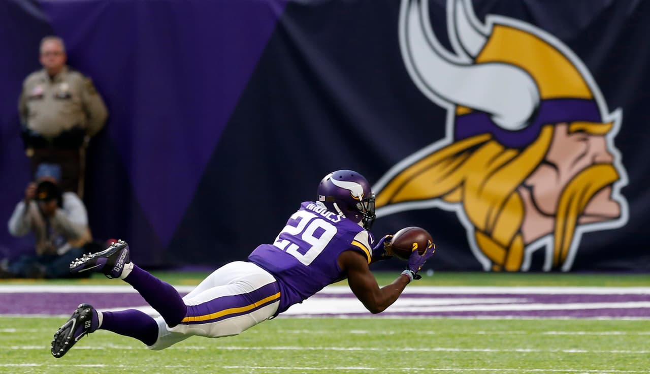 Minnesota Vikings cornerback Xavier Rhodes (29) intercepts a pass during the second half of an NFL football game against the Arizona Cardinals Sunday, Nov. 20, 2016, in Minneapolis. (AP Photo/Jim Mone)