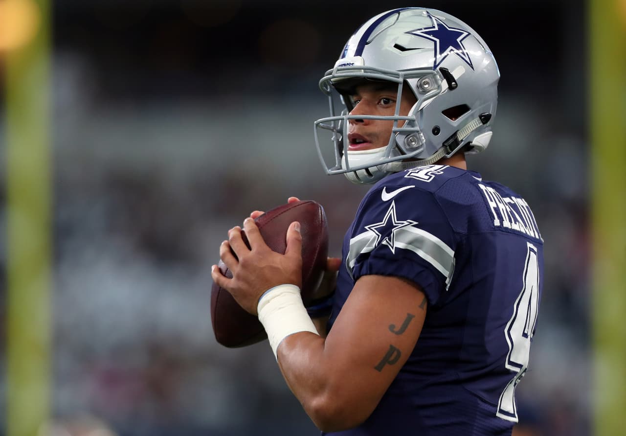 ARLINGTON, TX - NOVEMBER 24: Dak Prescott #4 of the Dallas Cowboys warms up on the field prior to the game against the Washington Redskins at AT&T Stadium on November 24, 2016 in Arlington, Texas. (Photo by Tom Pennington/Getty Images)