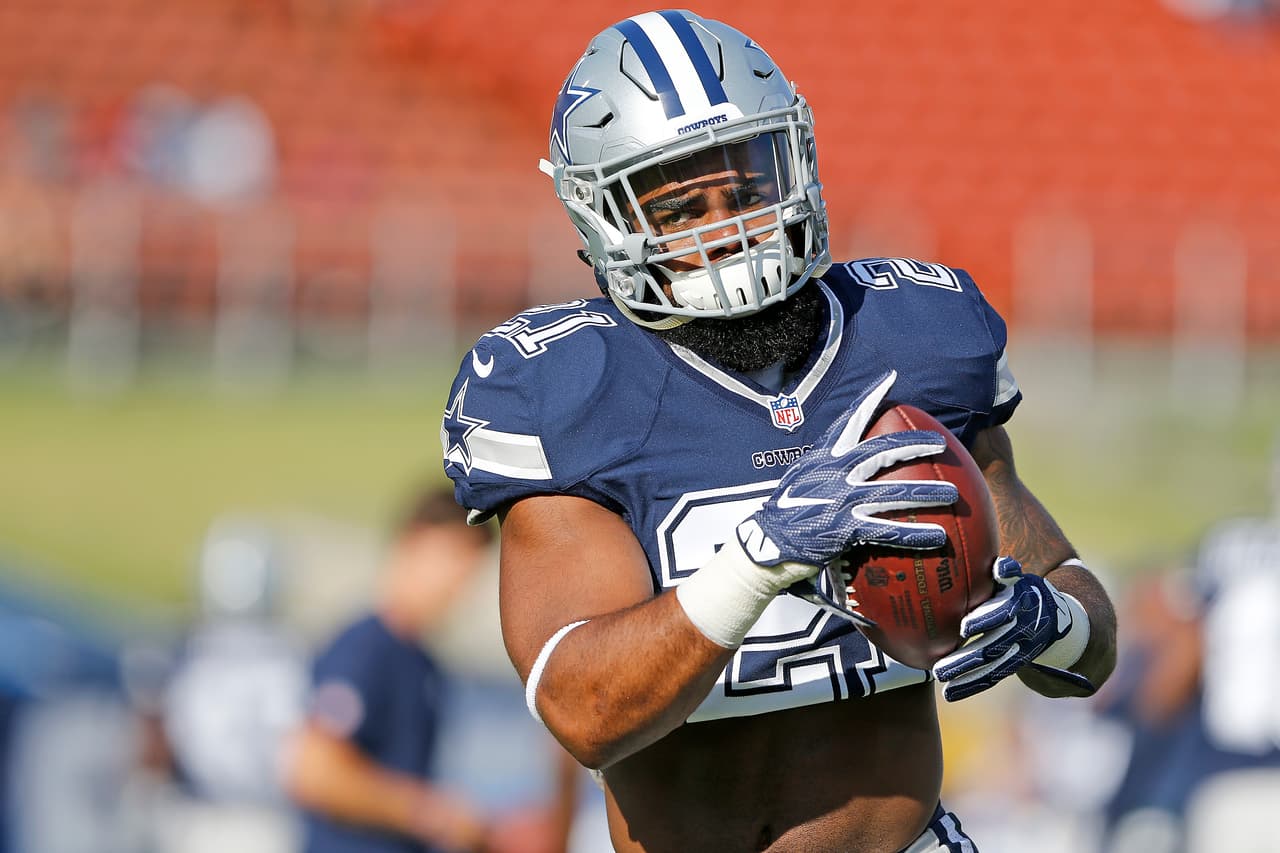 Dallas Cowboys running back Ezekiel Elliott (21) runs after a catch before an NFL preseason football game against the Los Angeles Rams, Saturday, Aug. 12, 2017 in Los Angeles. The Rams defeated the Cowboys, 13-10. (James D. Smith via AP)
