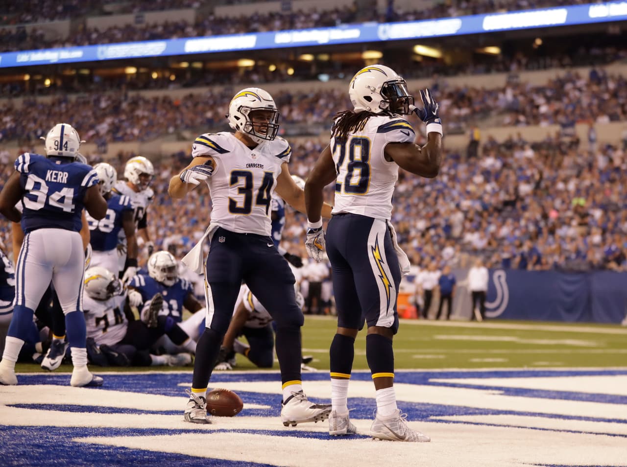 San Diego Chargers' Melvin Gordon (28) celebrates after scoring on a one-yard touchdown run during the second half of an NFL football game against the Indianapolis Colts, Sunday, Sept. 25, 2016, in Indianapolis. (AP Photo/Jeff Roberson)