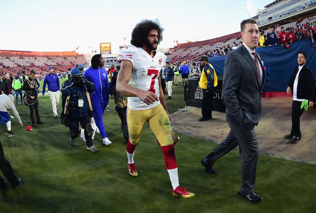 LOS ANGELES, CA - DECEMBER 24: Colin Kaepernick #7 of the San Francisco 49ers walks off the field after defeating the Los Angeles Rams 22-21 at Los Angeles Memorial Coliseum on December 24, 2016 in Los Angeles, California. (Photo by Harry How/Getty Images)