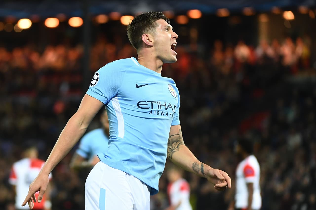 Manchester City's English defender John Stones celebrates after scoring his second goal during the UEFA Champions League Group F football match between Feyenoord Rotterdam and Manchester City at the Feyenoord Stadium in Rotterdam, on September 13, 2017. / AFP PHOTO / Emmanuel DUNAND (Photo credit should read EMMANUEL DUNAND/AFP/Getty Images)