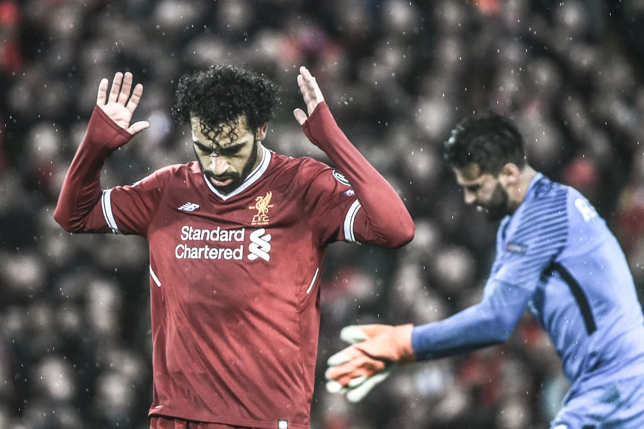 Liverpool's Egyptian midfielder Mohamed Salah celebrates after scoring their second goal during the UEFA Champions League first leg semi-final football match between Liverpool and Roma at Anfield stadium in Liverpool, north west England on April 24, 2018. (Photo by Filippo MONTEFORTE / AFP) (Photo credit should read FILIPPO MONTEFORTE/AFP/Getty Images)