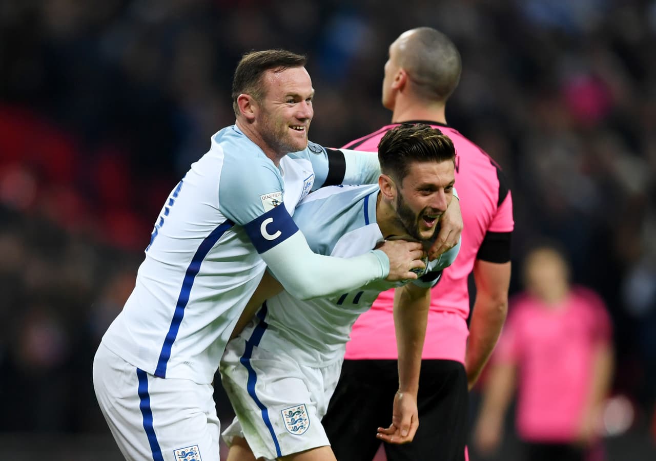 LONDON, ENGLAND - NOVEMBER 11: Adam Lallana of England (11) celebrates with Wayne Rooney as he scores their second goal during the FIFA 2018 World Cup qualifying match between England and Scotland at Wembley Stadium on November 11, 2016 in London, England. (Photo by Shaun Botterill/Getty Images)