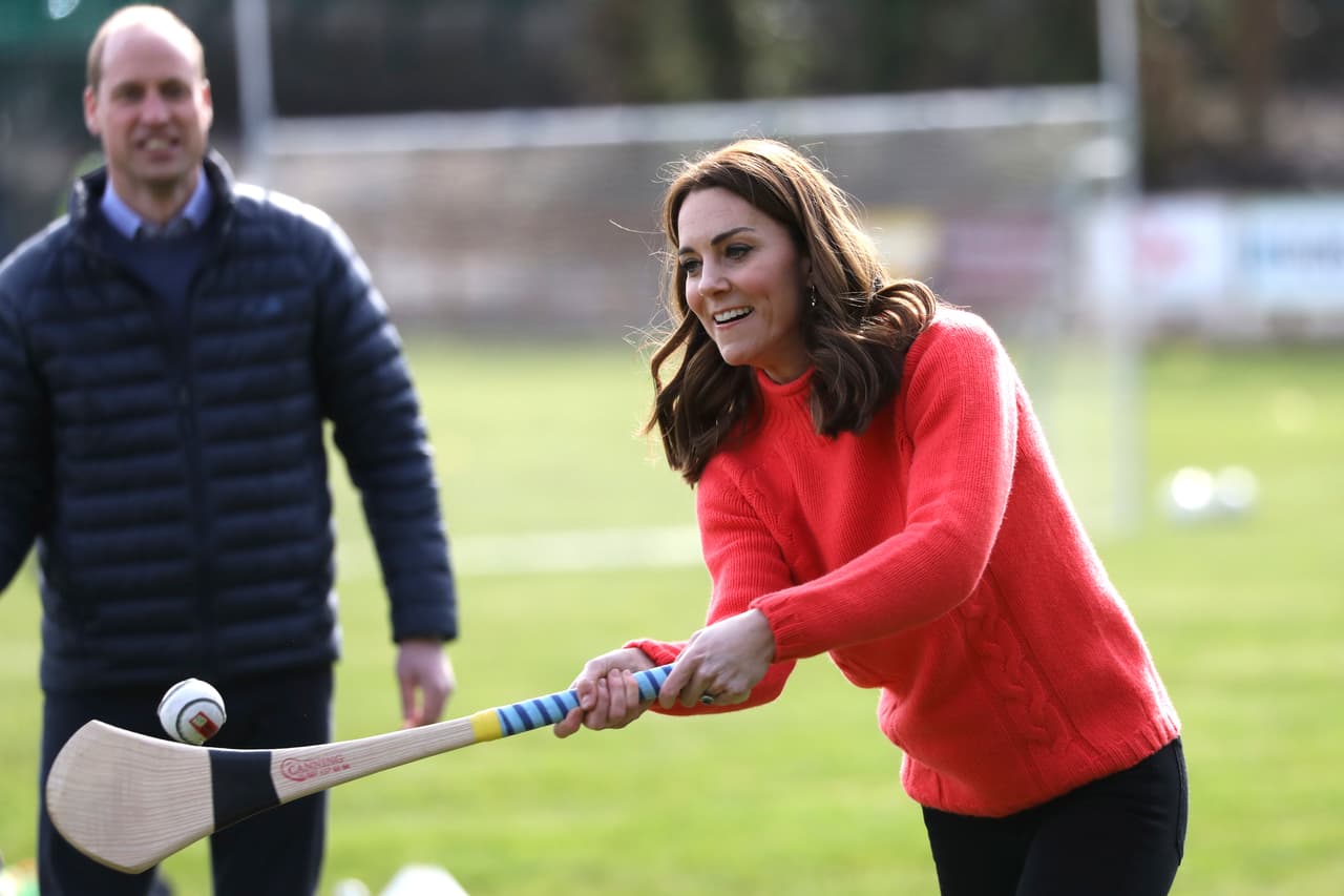 Kate the Duchess of Cambridge, right, tries hurling next to Britain's Prince William at Salthill Knocknacarra GAA Club in Galway, Ireland, Thursday, March 5, 2020. The Duke and Duchess of Cambridge visit Galway on the last of a three-day official visit to Ireland. (AP Photo/Peter Morrison)