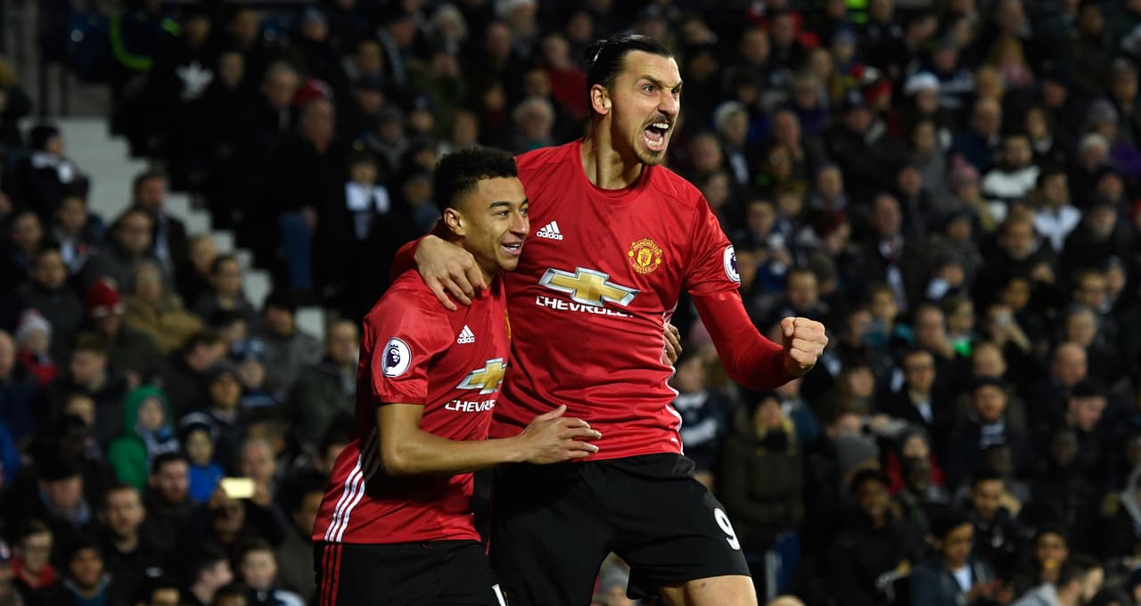 WEST BROMWICH, ENGLAND - DECEMBER 17: Zlatan Ibrahimovic of Manchester United (R) celebrates scoring his sides first goal with Jesse Lingard of Manchester United (L) during the Premier League match between West Bromwich Albion and Manchester United at The Hawthorns on December 17, 2016 in West Bromwich, England. (Photo by Stu Forster/Getty Images)