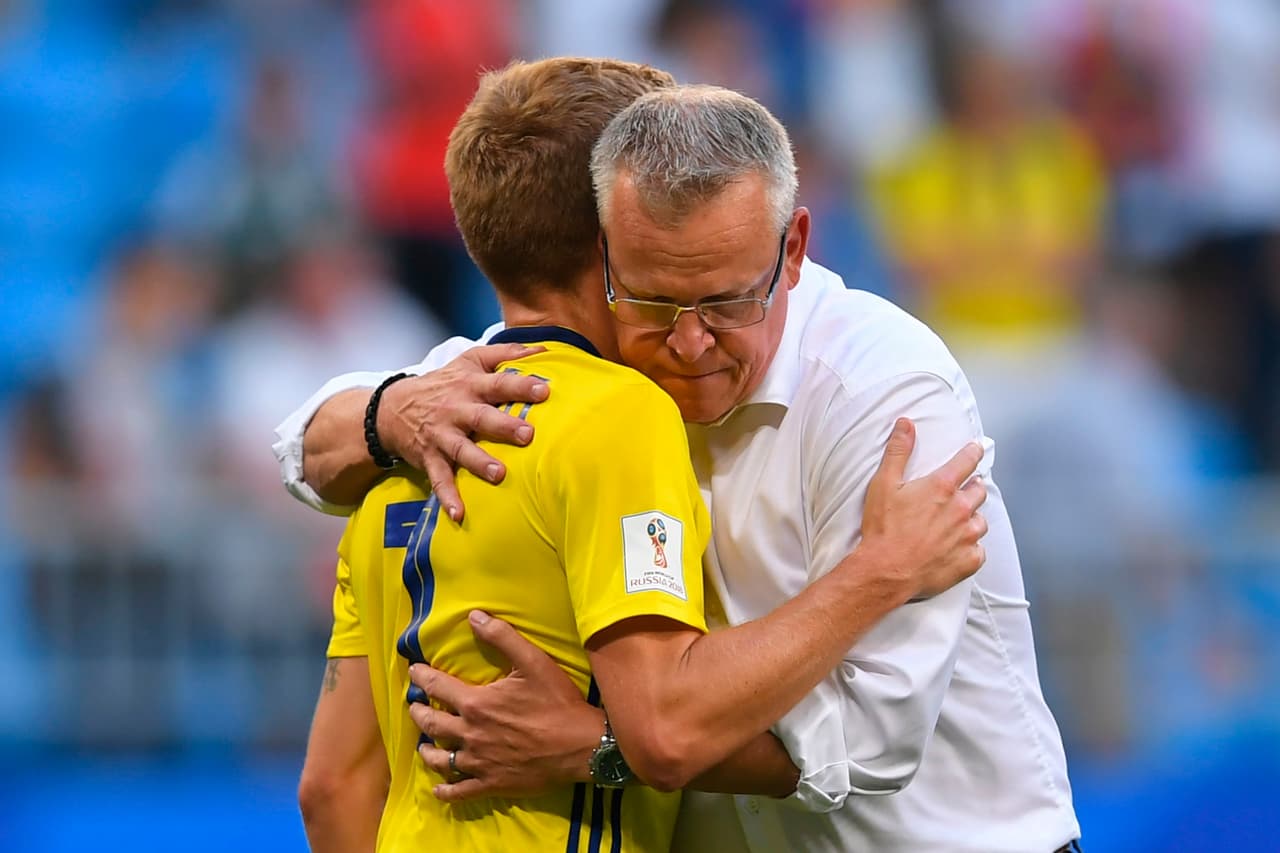 Sweden's midfielder Sebastian Larsson is embraced by Sweden's coach Janne Andersson after the Russia 2018 World Cup quarter-final football match between Sweden and England at the Samara Arena in Samara on July 7, 2018. - England beat Sweden 2-0 to reach World Cup semi-finals. (Photo by Manan VATSYAYANA / AFP) / RESTRICTED TO EDITORIAL USE - NO MOBILE PUSH ALERTS/DOWNLOADS (Photo credit should read MANAN VATSYAYANA/AFP/Getty Images)