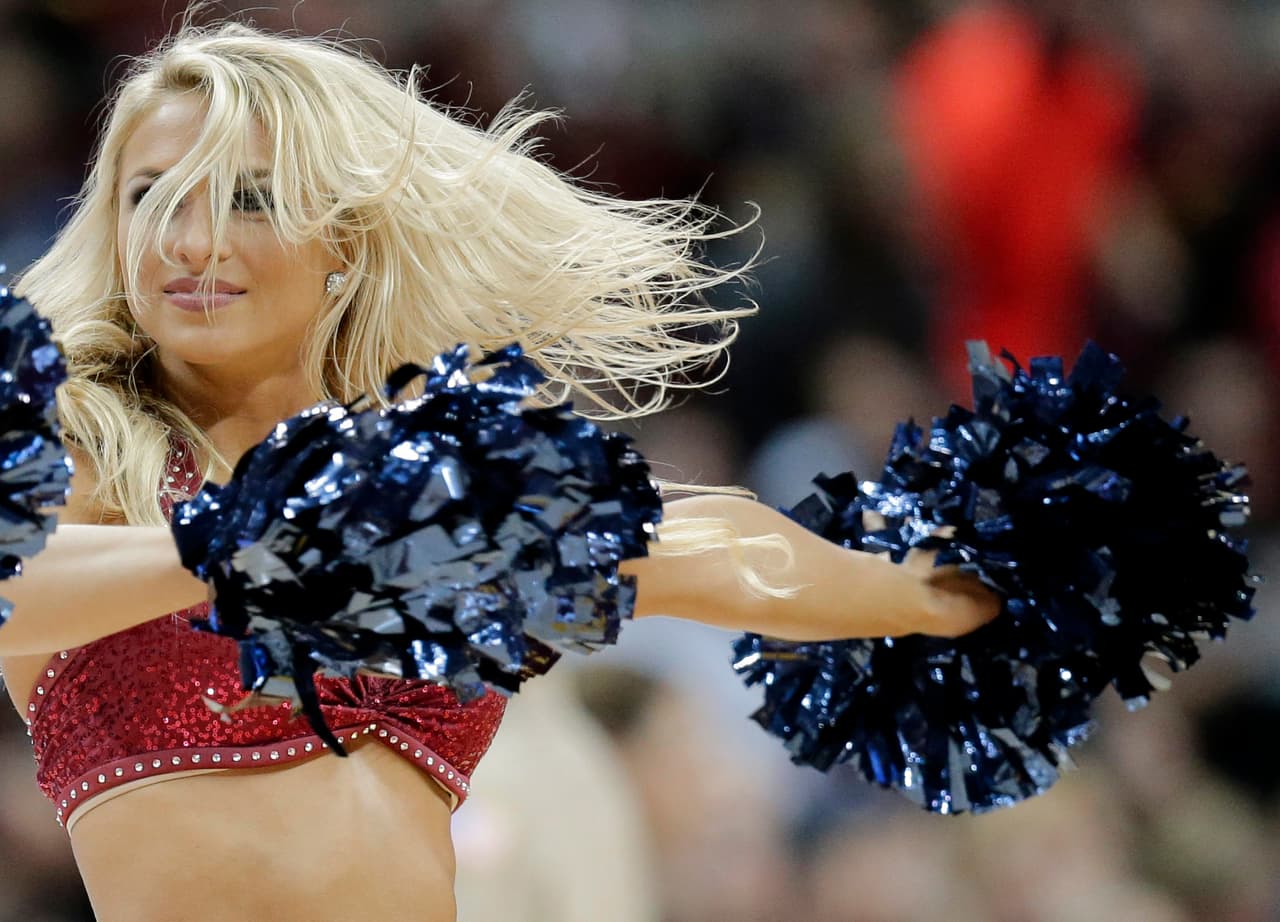 A Cleveland Cavaliers cheerleader performs in the second half of an NBA basketball game between the Sacramento Kings and the Cleveland Cavaliers, Monday, Feb. 8, 2016, in Cleveland. (AP Photo/Tony Dejak)