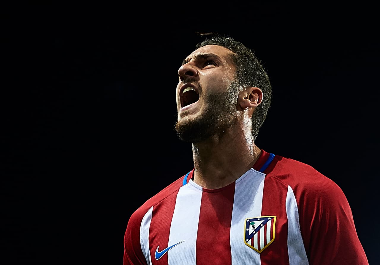 MALAGA, SPAIN - APRIL 01: Koke Resurreccion of Club Atletico de Madrid (L) celebrates after scoring the first goal for Club Atletico de Madrid during La Liga match between Malaga CF and Club Atletico de Madrid at La Rosaleda Stadium April 01, 2017 in Malaga, Spain. (Photo by Aitor Alcalde/Getty Images)