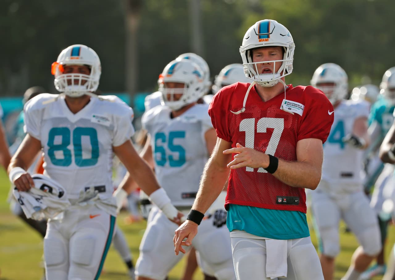 Miami Dolphins quarterback Ryan Tannehill (17) warms up during an NFL football training camp, Thursday, Aug. 3, 2017 at the Dolphins training facility in Davie, Fla. (AP Photo/Wilfredo Lee)