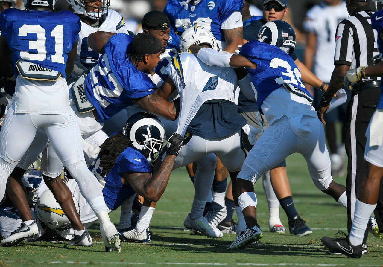 One of several scuffles breaks out during a joint NFL football practice held by the Los Angeles Rams and the Los Angeles Chargers, Wednesday, Aug. 9, 2017, in Irvine, Calif. (AP Photo/Mark J. Terrill)
