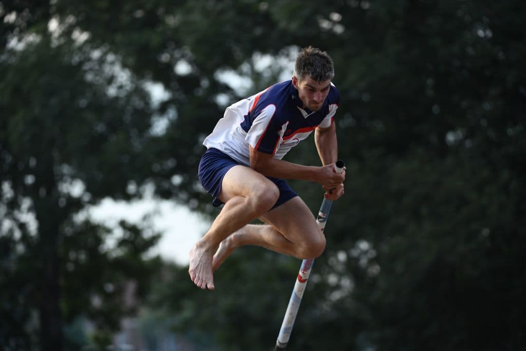 An athlete takes part in a Frisian pole-jumping "Fierljeppen" competiton in It Heidenskip, in the Dutch province of Friesland, on August 16, 2017. The first official fierljeppen competition was held in 1957 in the frisian town of Winsum, and in 1978 the official Frysk Ljeppers Boun, the sports official federation was born. The sport however remains relatively unknown -- even in the rest of The Netherlands -- but was first introduced to the world when contestants taking part in the popular Amazing Race reality competition in 2007 had to leap across a ditch. These days, some 250 men and women jumpers compete across three tiers in some 60 competitions across the summer. / AFP PHOTO / JOHN THYS (Photo credit should read JOHN THYS/AFP via Getty Images)