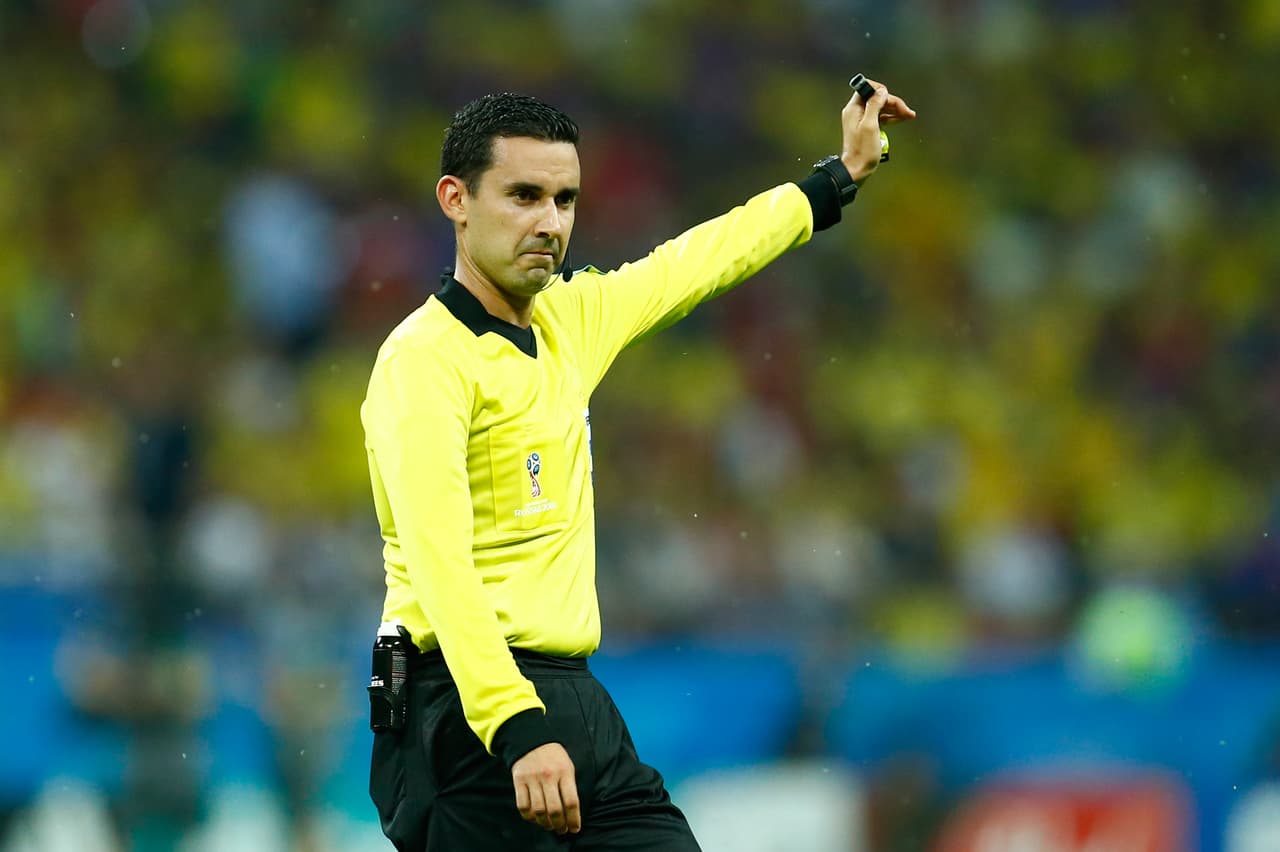 Mexican referee Cesar Ramos gestures during the Russia 2018 World Cup Group H football match between Poland and Colombia at the Kazan Arena in Kazan on June 24, 2018. Colombia won 0-3. (Photo by BENJAMIN CREMEL / AFP) / RESTRICTED TO EDITORIAL USE - NO MOBILE PUSH ALERTS/DOWNLOADS (Photo credit should read BENJAMIN CREMEL/AFP/Getty Images)