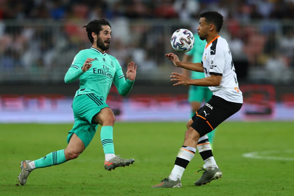 JEDDAH, SAUDI ARABIA - JANUARY 08: Isco of Real Madrid takes on Francis Coquelin of Valencia during the Supercopa de Espana Semi-Final match between Valencia CF and Real Madrid at King Abdullah Sports City on January 08, 2020 in Jeddah, Saudi Arabia. (Photo by Francois Nel/Getty Images)