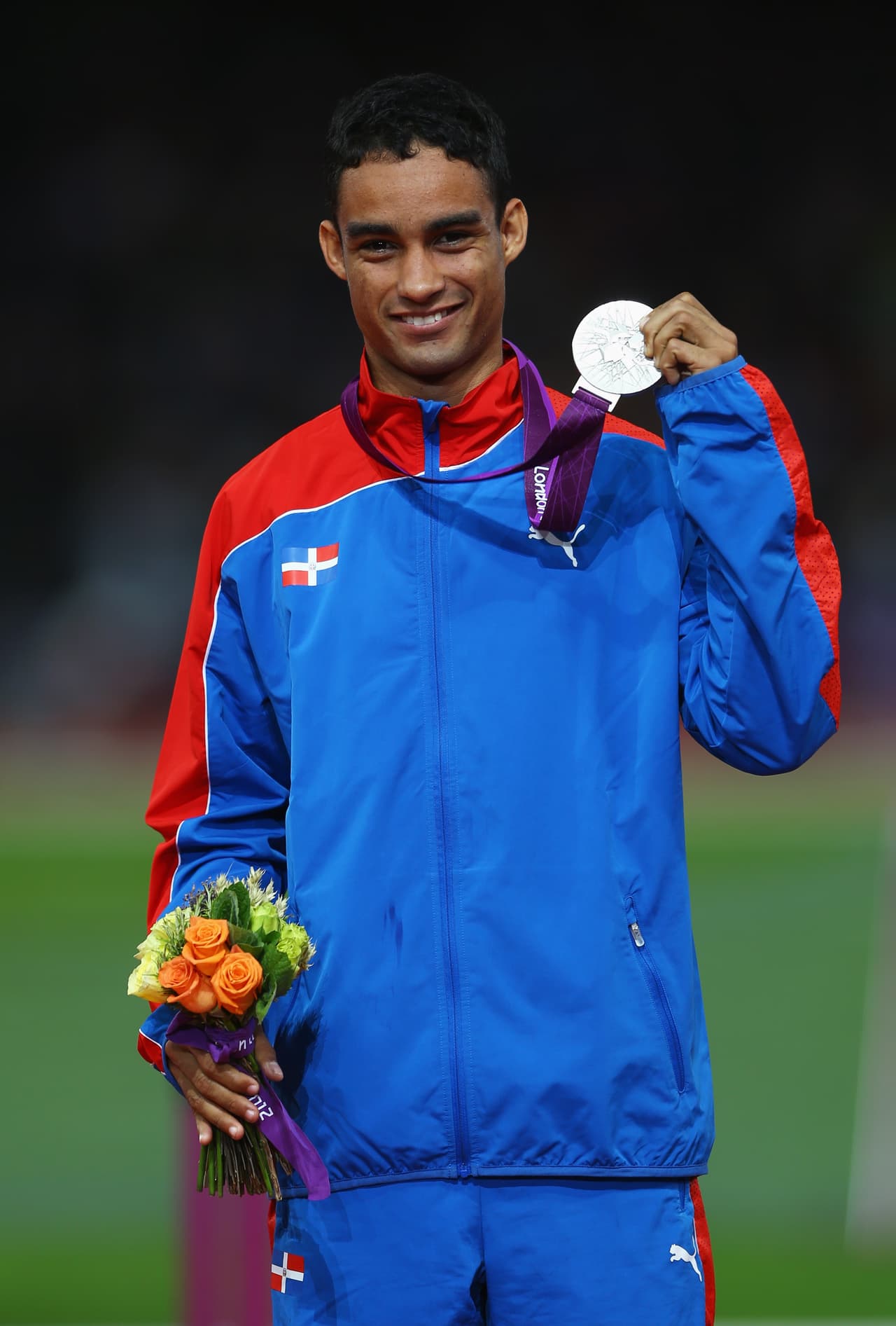 LONDON, ENGLAND - AUGUST 07: Silver medalist Luguelin Santos of Dominican Republic poses on the podium during the medal ceremony for the Men's 400m on Day 11 of the London 2012 Olympic Games at Olympic Stadium on August 7, 2012 in London, England. (Photo by Paul Gilham/Getty Images)