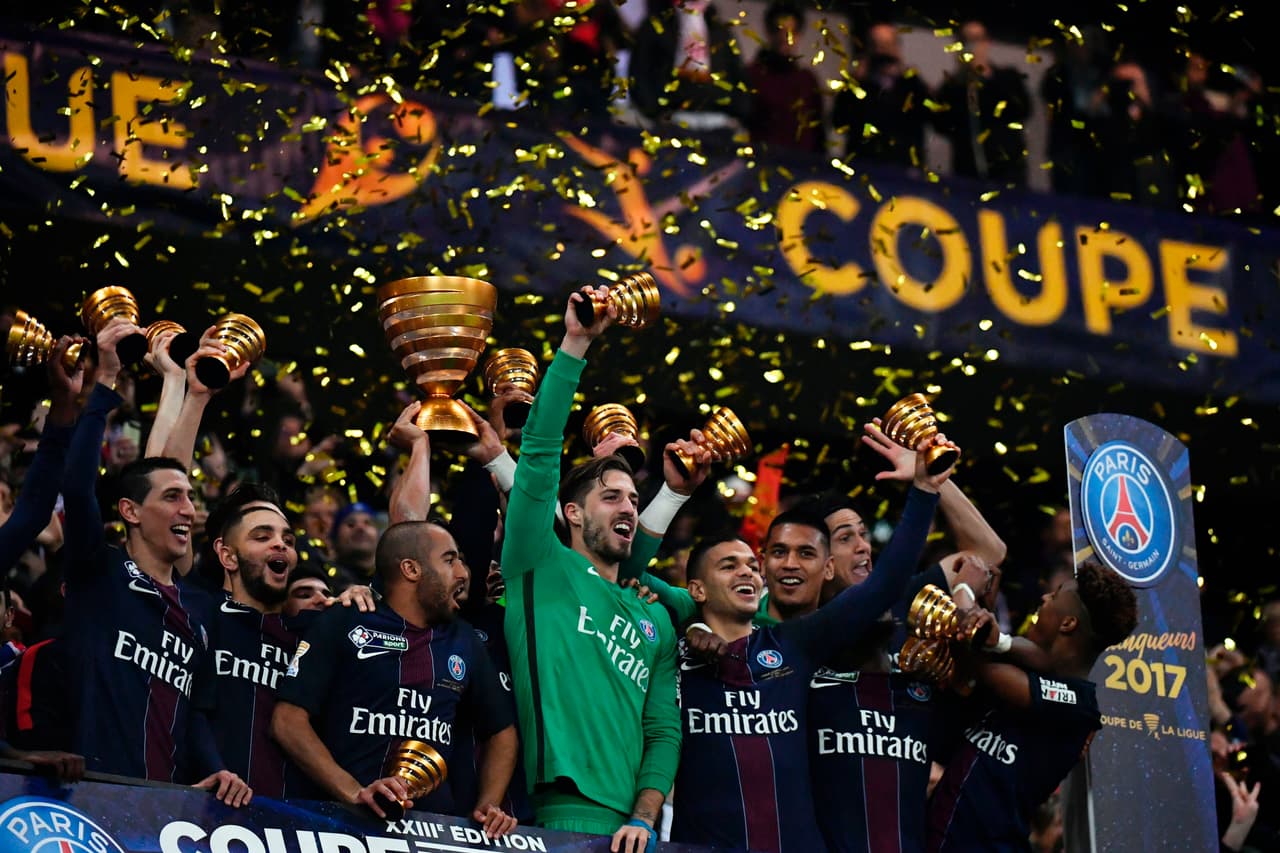 Paris Saint-Germain's players celebrate after winning the French League Cup final football match between Paris Saint-Germain (PSG) and Monaco (ASM) on April 1, 2017, at the Parc Olympique Lyonnais stadium in Decines-Charpieu, near Lyon. / AFP PHOTO / Jeff PACHOUD (Photo credit should read JEFF PACHOUD/AFP/Getty Images)