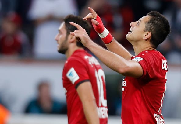 Leverkusen, Germany 01.10.2016, 1. Bundesliga 6. Spieltag, Bayer 04 Leverkusen - Borussia Dortmund, Torjubel Chicharito (Leverkusen, R) mit Hakan Calhanoglu. (Photo by TF-Images/Getty Images)