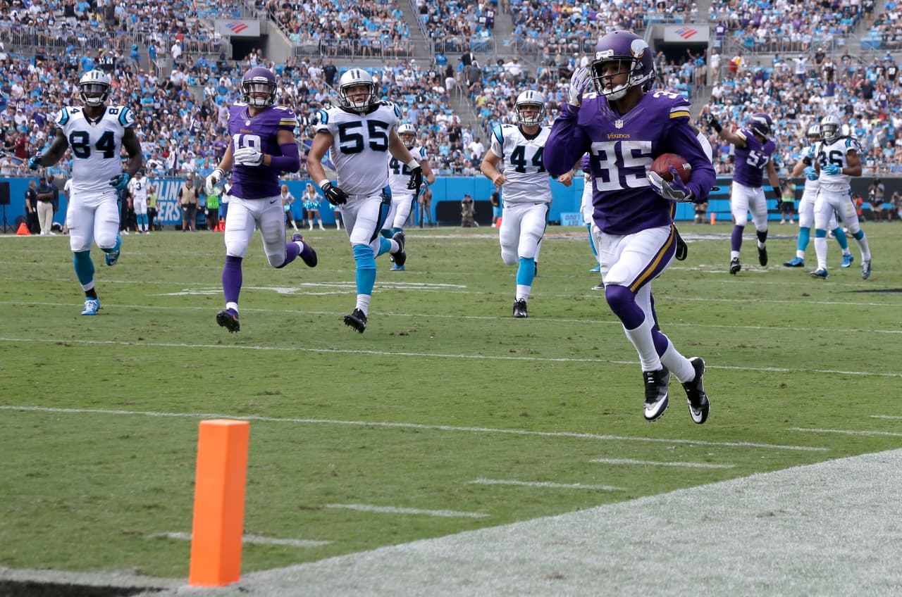Minnesota Vikings' Marcus Sherels (35) runs for a touchdown against the Carolina Panthers in the first half of an NFL football game in Charlotte, N.C., Sunday, Sept. 25, 2016. (AP Photo/Bob Leverone)