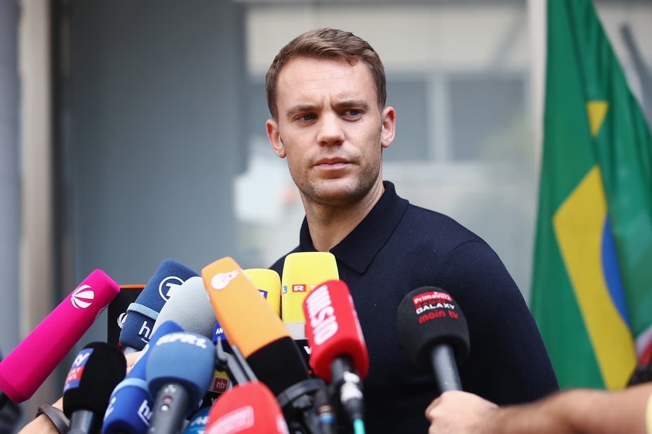 FRANKFURT AM MAIN, GERMANY - JUNE 28: Manuel Neuer talks to the media during the return of the German national football team from the FIFA World Cup Russia 2018 at Frankfurt International Airport on June 28, 2018 in Frankfurt am Main, Germany. (Photo by Alex Grimm/Bongarts/Getty Images)