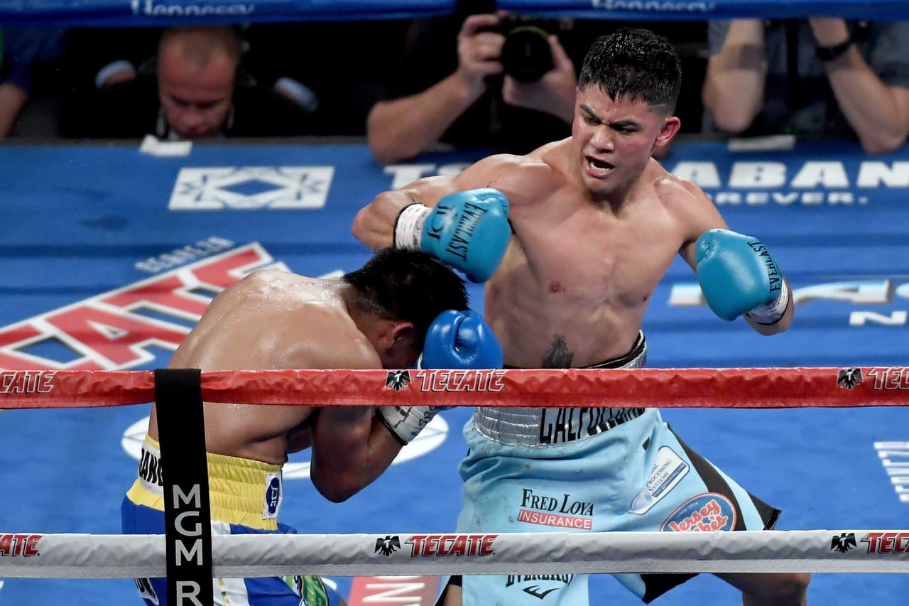 LAS VEGAS, NV - SEPTEMBER 16: (R-L) Joseph Diaz Jr. throws a punch at Rafael Rivera during their featherweight bout at T-Mobile Arena on September 16, 2017 in Las Vegas, Nevada. (Photo by Ethan Miller/Getty Images)