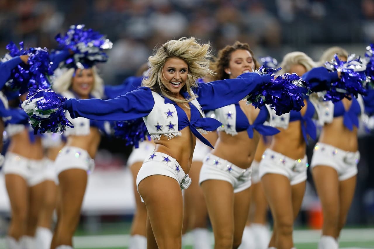 Dallas Cowboys cheerleaders perform during the first half of a preseason NFL football game against the Arizona Cardinals in Arlington, Texas, Sunday, Aug. 26, 2018. (AP Photo/Roger Steinman)