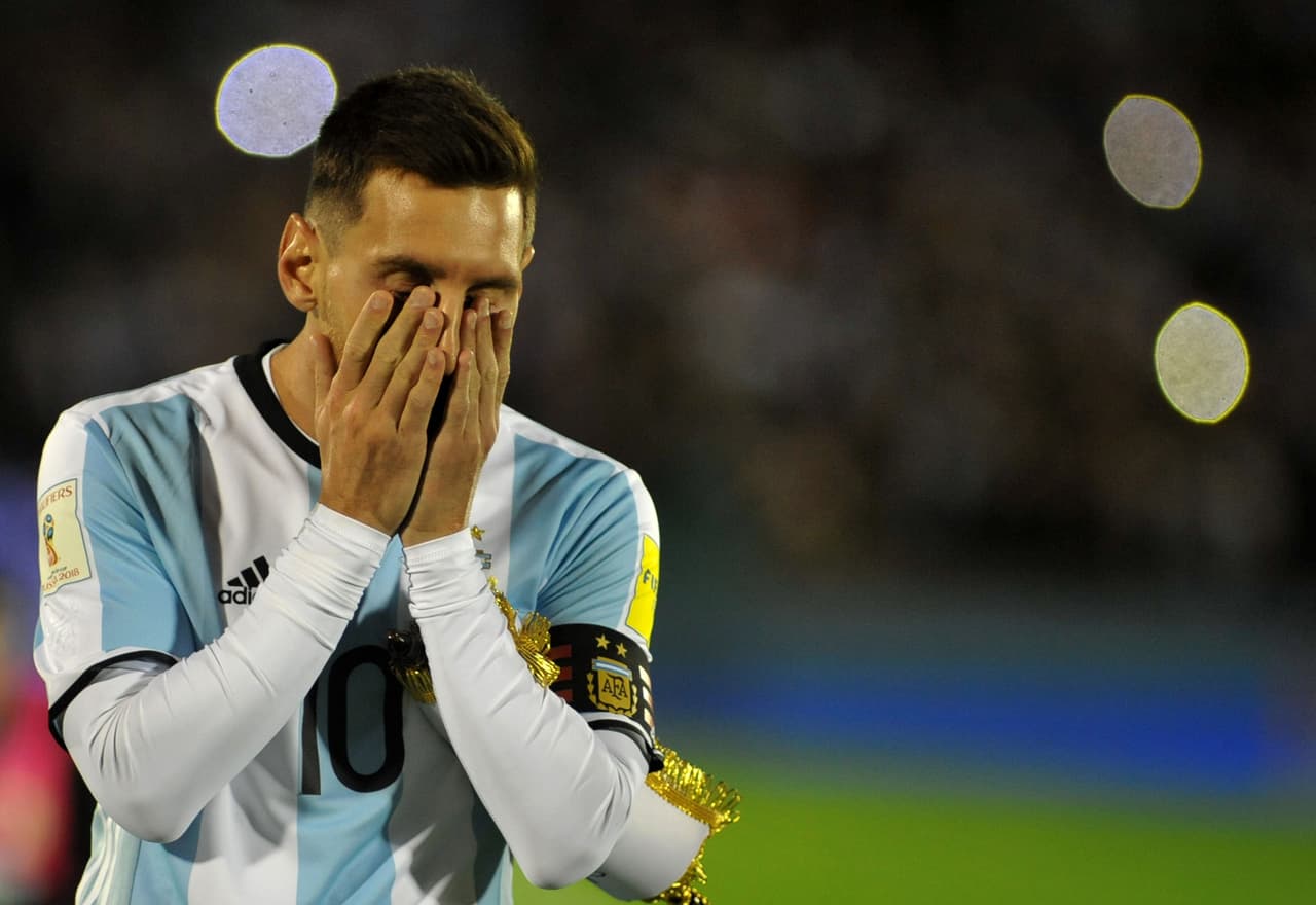 Argentina's Lionel Messi gestures at the end of the 2018 World Cup qualifier football match against Uruguay in Montevideo, on August 31, 2017. The match ended 0-0. / AFP PHOTO / DANTE FERNANDEZ (Photo credit should read DANTE FERNANDEZ/AFP/Getty Images)