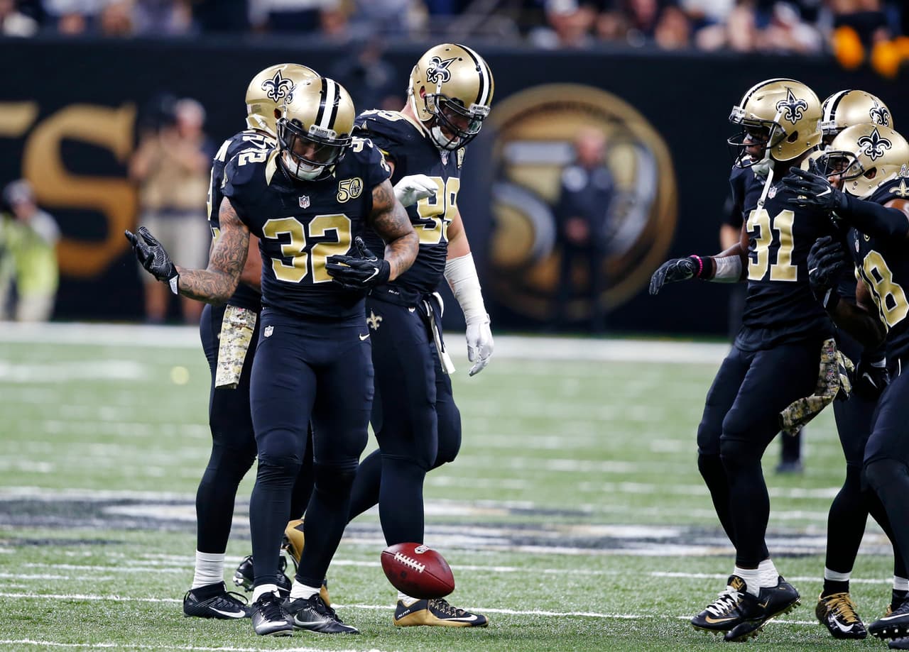 New Orleans Saints strong safety Kenny Vaccaro (32) celebrates his interception in the second half of an NFL football game in New Orleans, Sunday, Nov. 13, 2016. (AP Photo/John McCusker)