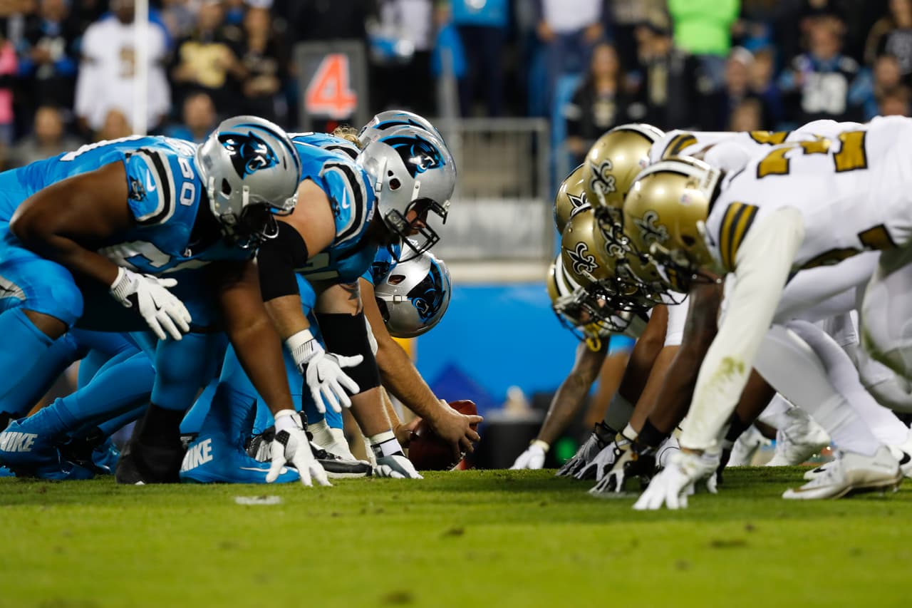 The Carolina Panthers offensive line lines up across the New Orleans Saints defensive line during an NFL football game on Thursday, Nov. 17, 2016, in Charlotte, N.C. Carolina won 23-20. (Aaron M. Sprecher via AP)