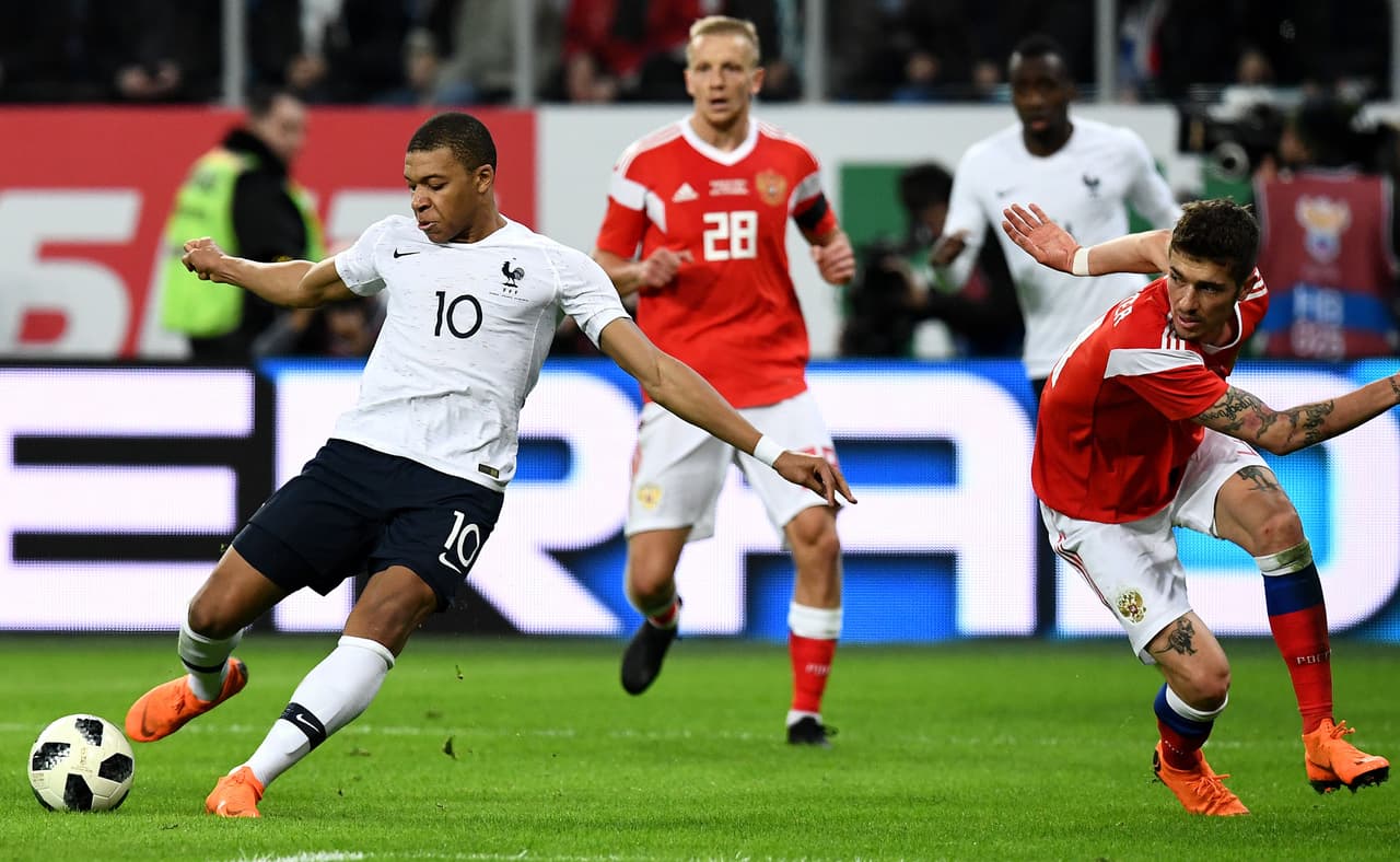 France's forward Kylian Mbappe shoots to score a goal during an international friendly football match between Russia and France at the Saint Petersburg Stadium in Saint Petersburg on March 27, 2018. / AFP PHOTO / FRANCK FIFE (Photo credit should read FRANCK FIFE/AFP/Getty Images)