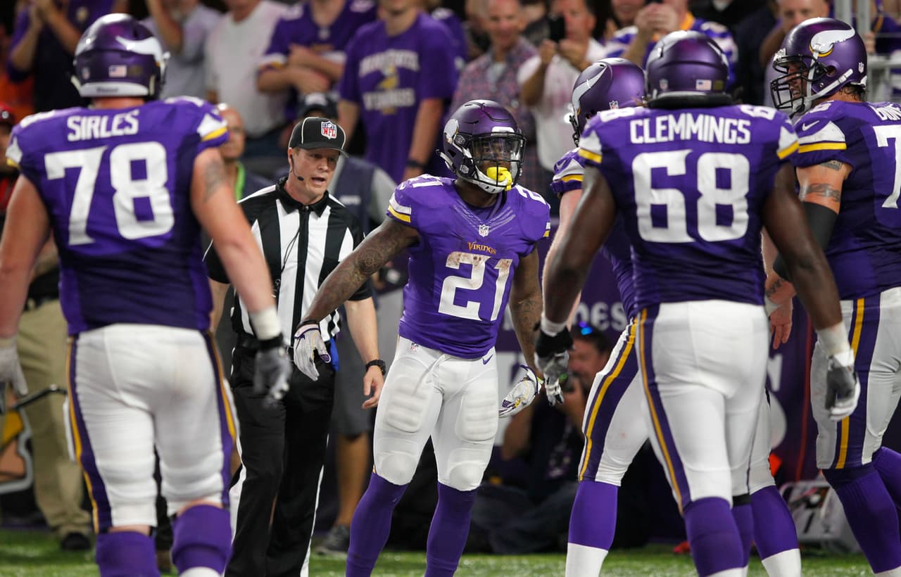 Minnesota Vikings running back Jerick McKinnon (21) celebrates with teammates after scoring on a 4-yard touchdown run during the second half of an NFL football game against the New York Giants Monday, Oct. 3, 2016, in Minneapolis. (AP Photo/Andy Clayton-King)