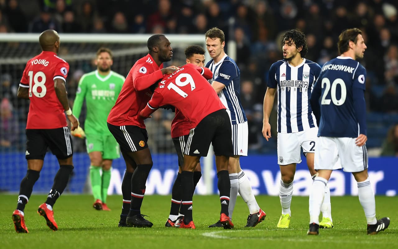 WEST BROMWICH, ENGLAND - DECEMBER 17: Jonny Evans of West Bromwich Albion, Romelu Lukaku of Manchester United and teammate Jesse Lingard hold back Marcus Rashford during a confrontation with Ahmed El-Sayed Hegazi of West Bromwich Albion during the Premier League match between West Bromwich Albion and Manchester United at The Hawthorns on December 17, 2017 in West Bromwich, England. (Photo by Michael Regan/Getty Images)