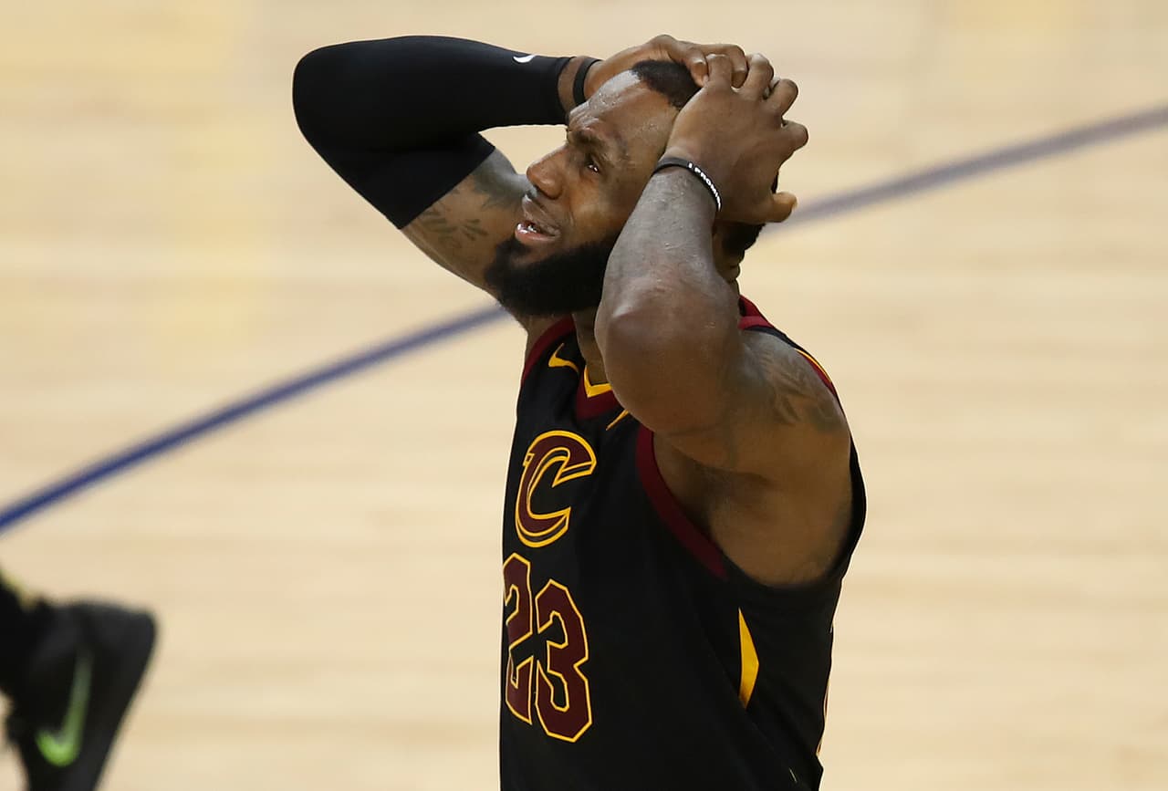 Cleveland Cavaliers forward LeBron James reacts to a call during the second half of Game 1 of basketball's NBA Finals between the Golden State Warriors and the Cavaliers in Oakland, Calif., Thursday, May 31, 2018. (AP Photo/Ben Margot)